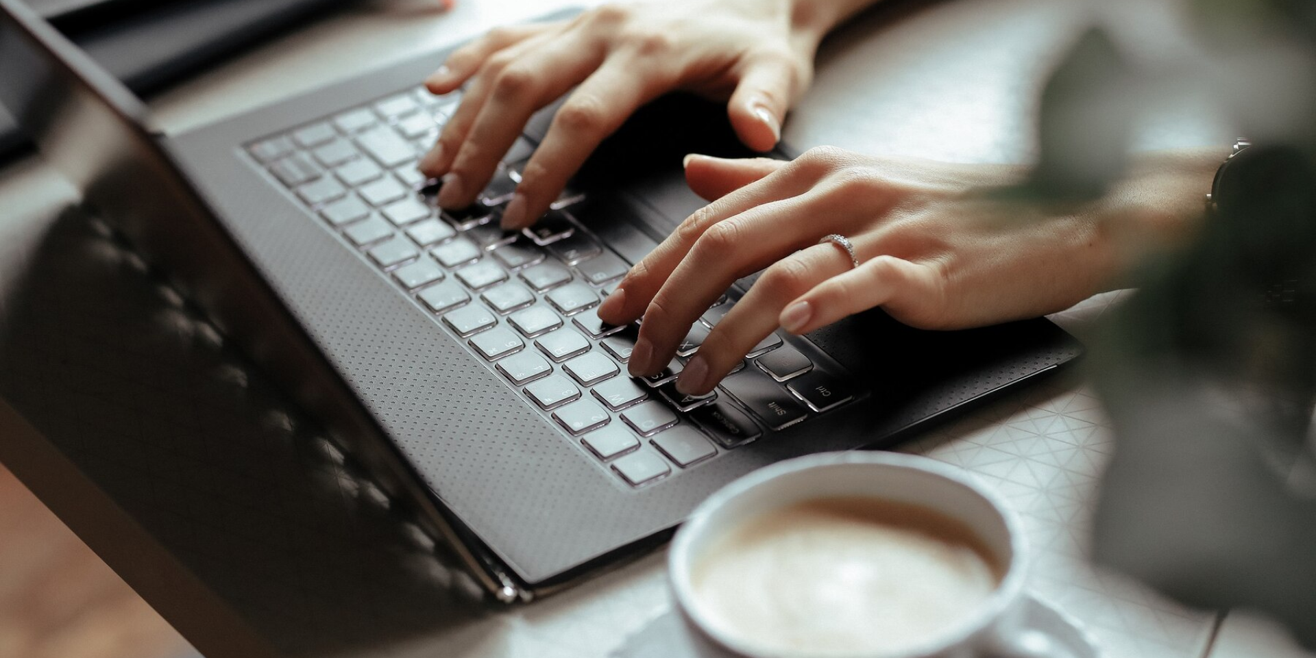 Image of person working on the laptop.